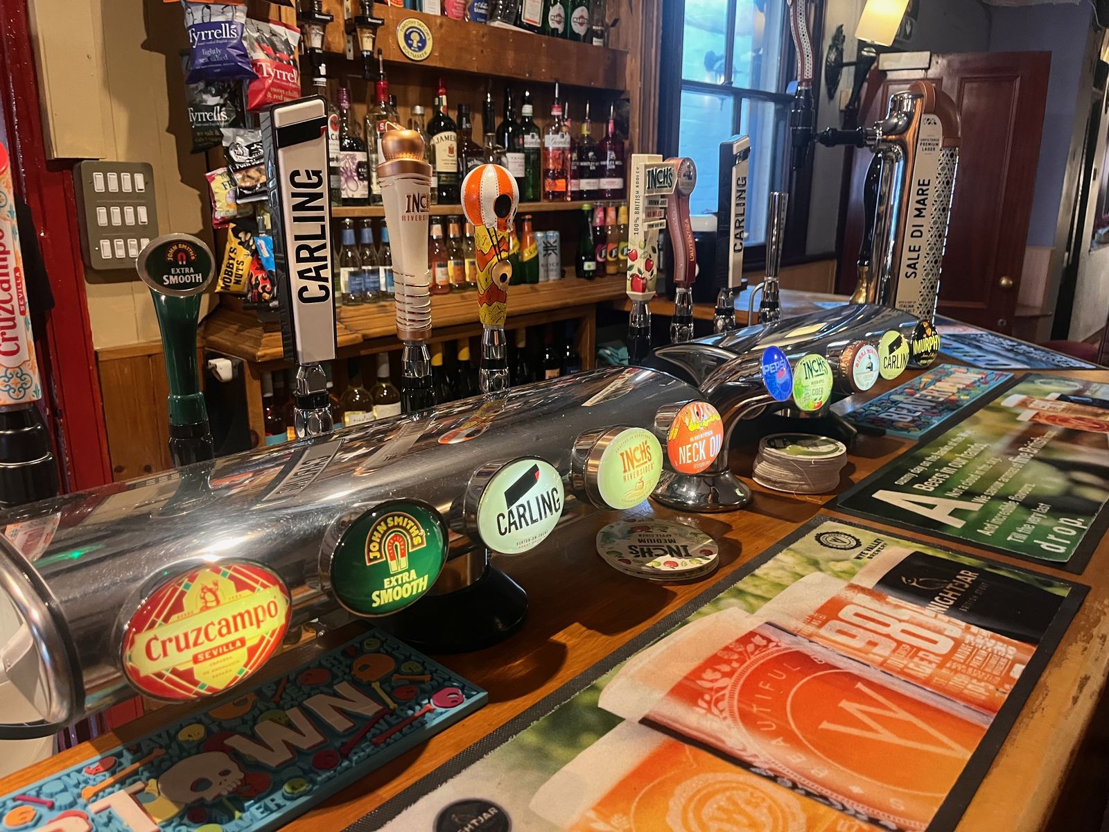 A pub bar with its beer taps